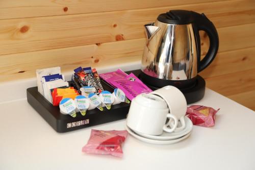 a coffee maker and a cup on a table at The Kellbank in Gosforth