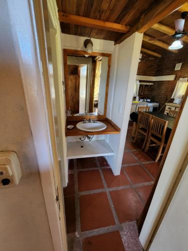 a bathroom with a sink and a mirror at Rukalafken in Mar Azul