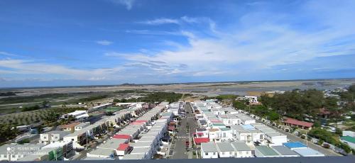 an aerial view of a city with many houses at Ecusuites Playas Preference Penthouse Jacuzzi & Vista Mar in Playas