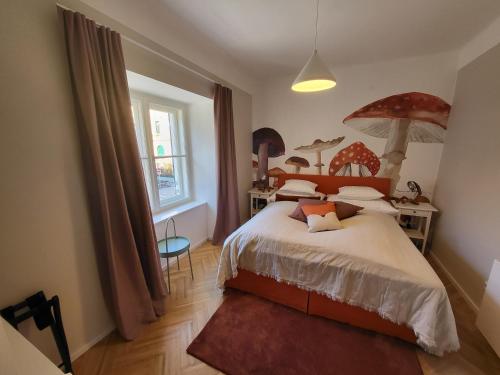 a bedroom with a bed with an umbrella on it at Orange Flat by GrazRentals highest standard & free parking in Graz