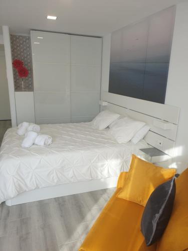 Un pat sau paturi într-o cameră la Estudio Amalfi