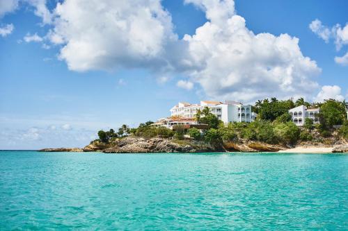 a resort on a small island in the ocean at Malliouhana Resort Anguilla in Meads Bay