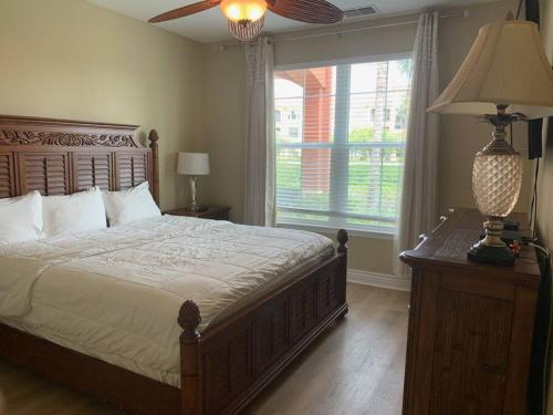 a bedroom with a large bed and a window at Luxury 5 star Italian Resort Condo 2 bd 2 bath in Clearwater