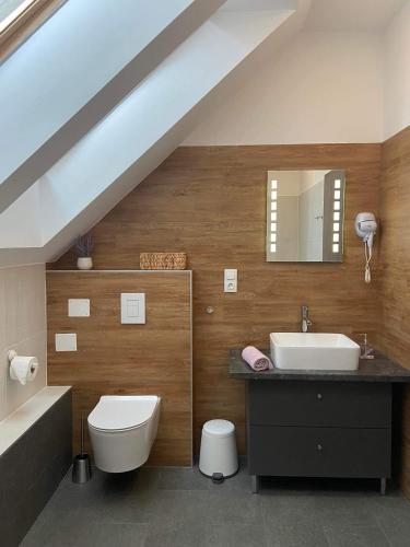 a bathroom with a sink and a toilet at Villa Corner in Tihany