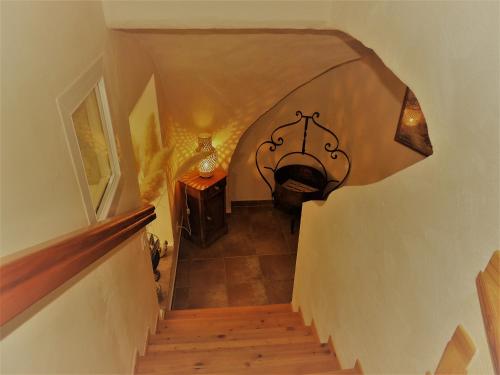 a view of a stairway with a hallway with a stair at Chambres d'hôtes La Dorgisane in Venterol