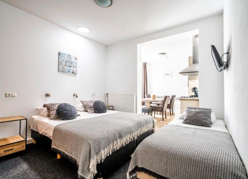 Кровать или кровати в номере Duinhotel Haga