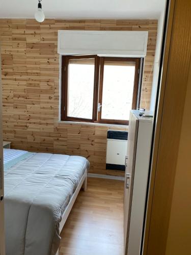Postel nebo postele na pokoji v ubytování La casetta di Gnappi