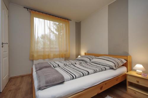 Voodi või voodid majutusasutuse Bodza apartman toas