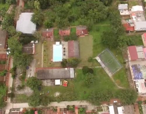 an aerial view of a yard with houses and trees at El Palmar in Guaduas