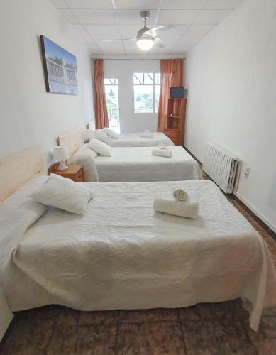 Postel nebo postele na pokoji v ubytování Mesón Kubano B&B