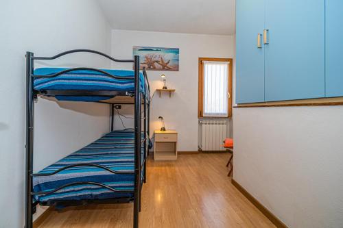 Łóżko lub łóżka piętrowe w pokoju w obiekcie Villa Soledad - Rosa dei Venti