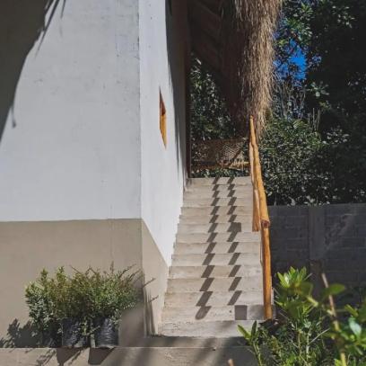 a set of stairs leading up to a building at Rustiko Palomino Sierra Nevada in Palomino