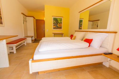 a bedroom with a large bed in a room at Hotel Elia in Guntramsdorf