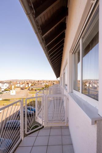 a balcony with a view of a parking lot at Hotel Nahetal in Gensingen