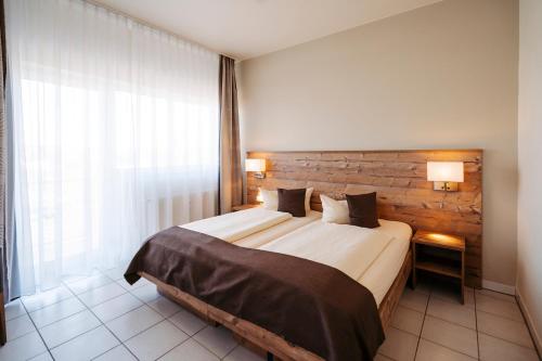 Postel nebo postele na pokoji v ubytování Hotel Nahetal
