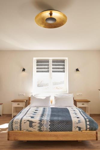 Ένα ή περισσότερα κρεβάτια σε δωμάτιο στο Urtica apartmány