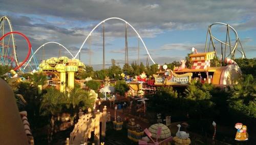 a large amusement park with a roller coaster at Alquiler Vacacional Salou W&S in Salou