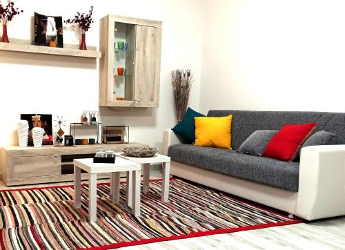 a living room with a couch and two tables at LA CASA DI FRANCESCO in Putifigari