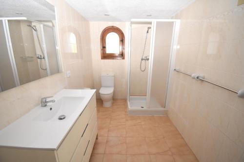 a bathroom with a sink and a shower and a toilet at Casa la Selva Javea - 5043 in Jávea