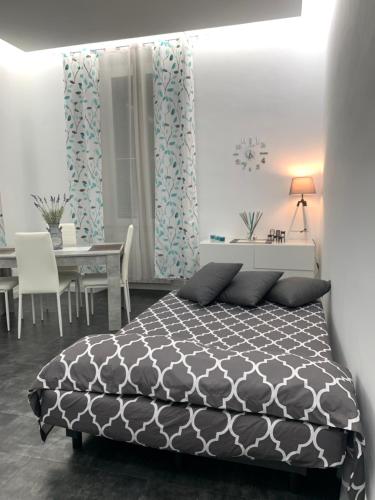 Кровать или кровати в номере L'isola di Kalyta