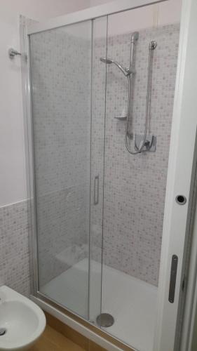 a shower with a glass door in a bathroom at Villa Azzurra Scale of the Turks in Realmonte