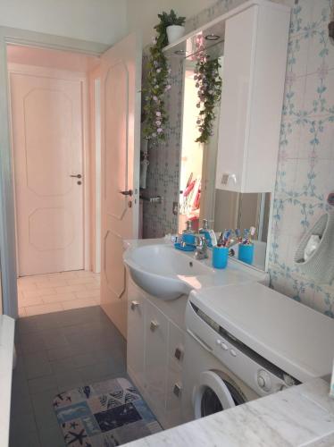 a bathroom with a sink and a mirror at Dream Travel Home in Formia
