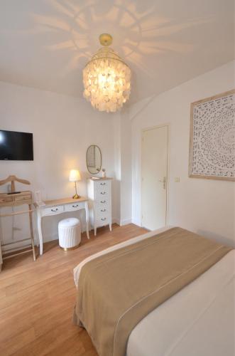 Katil atau katil-katil dalam bilik di Demeures & Châteaux - Hôtel de la porte Saint-Malo - DINAN
