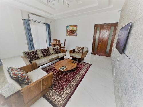 a living room with a couch and a table at Les Residences de la Diaspora in Dakar