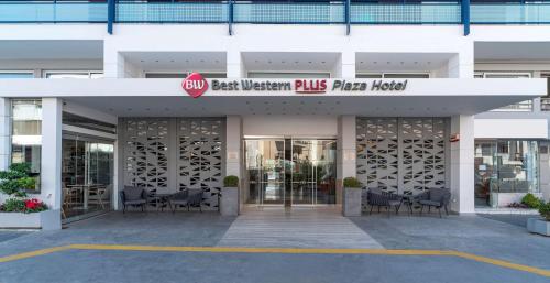 
a large building with a walkway leading to a lobby area at Best Western Plus Hotel Plaza in Rhodes Town

