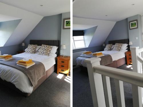 twee bedden in een kamer met blauwe muren bij Gwdihw in Ifton Heath