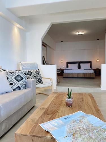 a living room with a couch and a coffee table at Nostos home in Dhragoulás