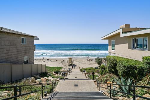 a pathway leading to a beach with a house and the ocean at 3009 Ocean Street in Carlsbad