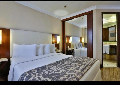 Cama o camas de una habitación en Transamerica Paulista Flats