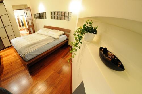 En eller flere senge i et værelse på Atena - Pantheon Apartments