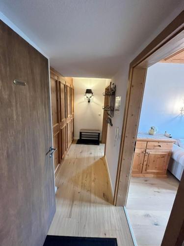 a hallway with a door leading into a room at Ferienhaus Heimhof in Garmisch-Partenkirchen