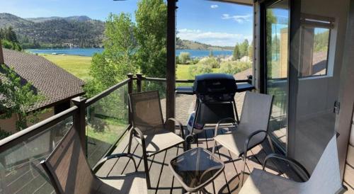 a porch with chairs and a view of a lake at Rr-edgewater04 in June Lake