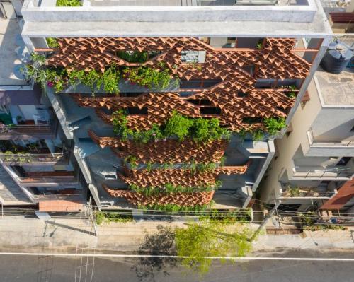 an overhead view of a building with a roof with plants at Iris Suites in Bengaluru