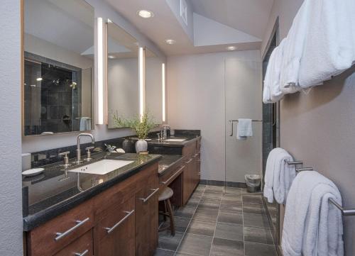a bathroom with two sinks and a large mirror at Vail Point 7 townhouse in Vail