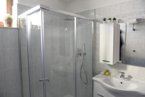 a bathroom with a shower and a sink at Fornillo 41 in Poggiomarino
