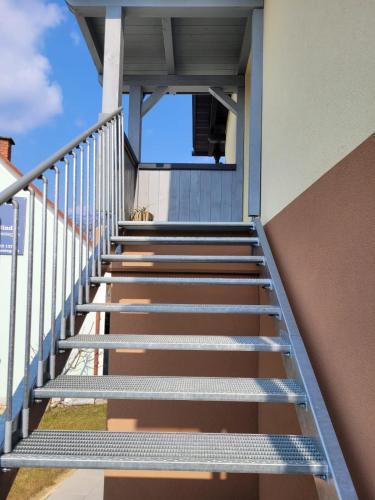 a set of stairs leading up to a building at Ferienwohnung Stoisser in Mureck