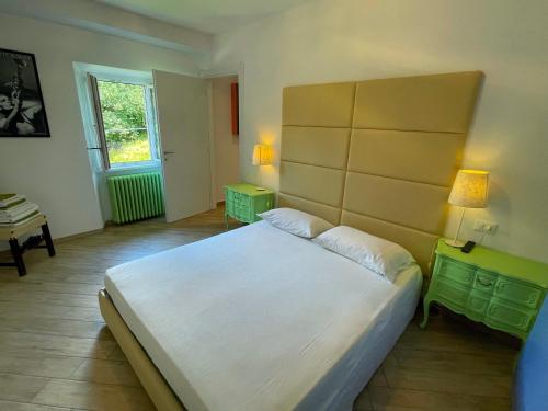Кровать или кровати в номере Antica Residenza I Ronchi Di Bellagio
