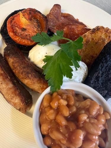 a plate of food with beans and other foods at The Beresford Arms in Morpeth