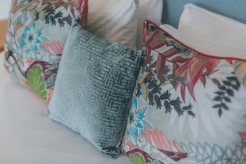 two pillows sitting on top of a couch at Florence House Boutique Hotel and Restaurant in Portsmouth