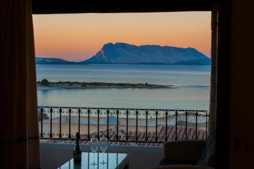 a view of the ocean from a balcony at Villa Isuledda Prestige in San Teodoro