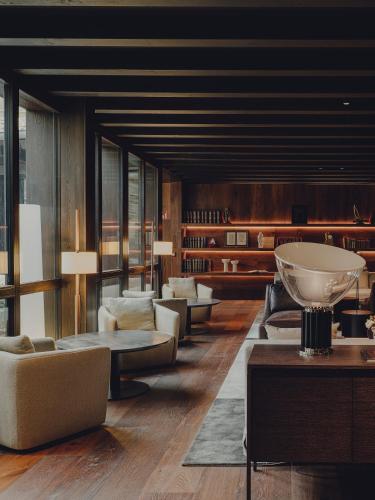 a lobby with couches and tables in a building at Santa María Briones in Briones