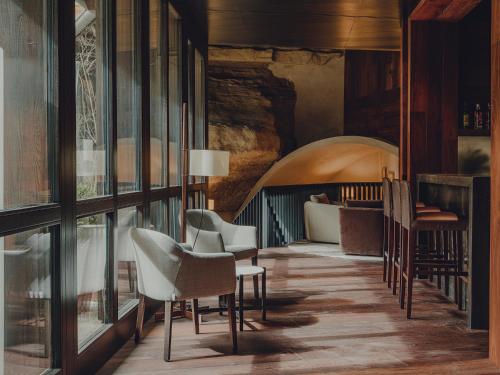 a rendering of a hotel lobby with chairs and a bed at Santa María Briones in Briones