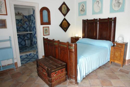 Un ou plusieurs lits dans un hébergement de l'établissement Turistcasa - Villa La Scalinatella