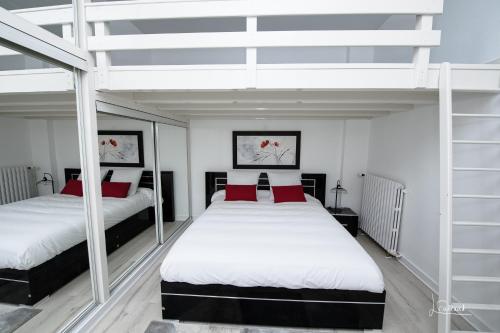 Una cama o camas en una habitación de Le Happy - Épinal centre
