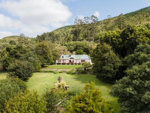 an aerial view of a house in the mountains at Ganzvlei Manor in Knysna