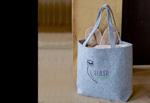 a tote bag with a drawing of a cat on it at Euler Neuschönau - Naturhotel & Chalets in Neuschönau